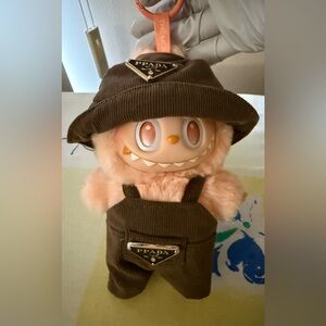 Pop Mart Labubu energy Happiness with Prada clothes.